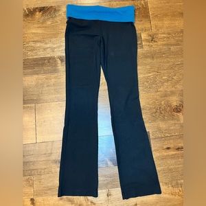 Women’s black Mossimo yoga pants with blue striped waist band